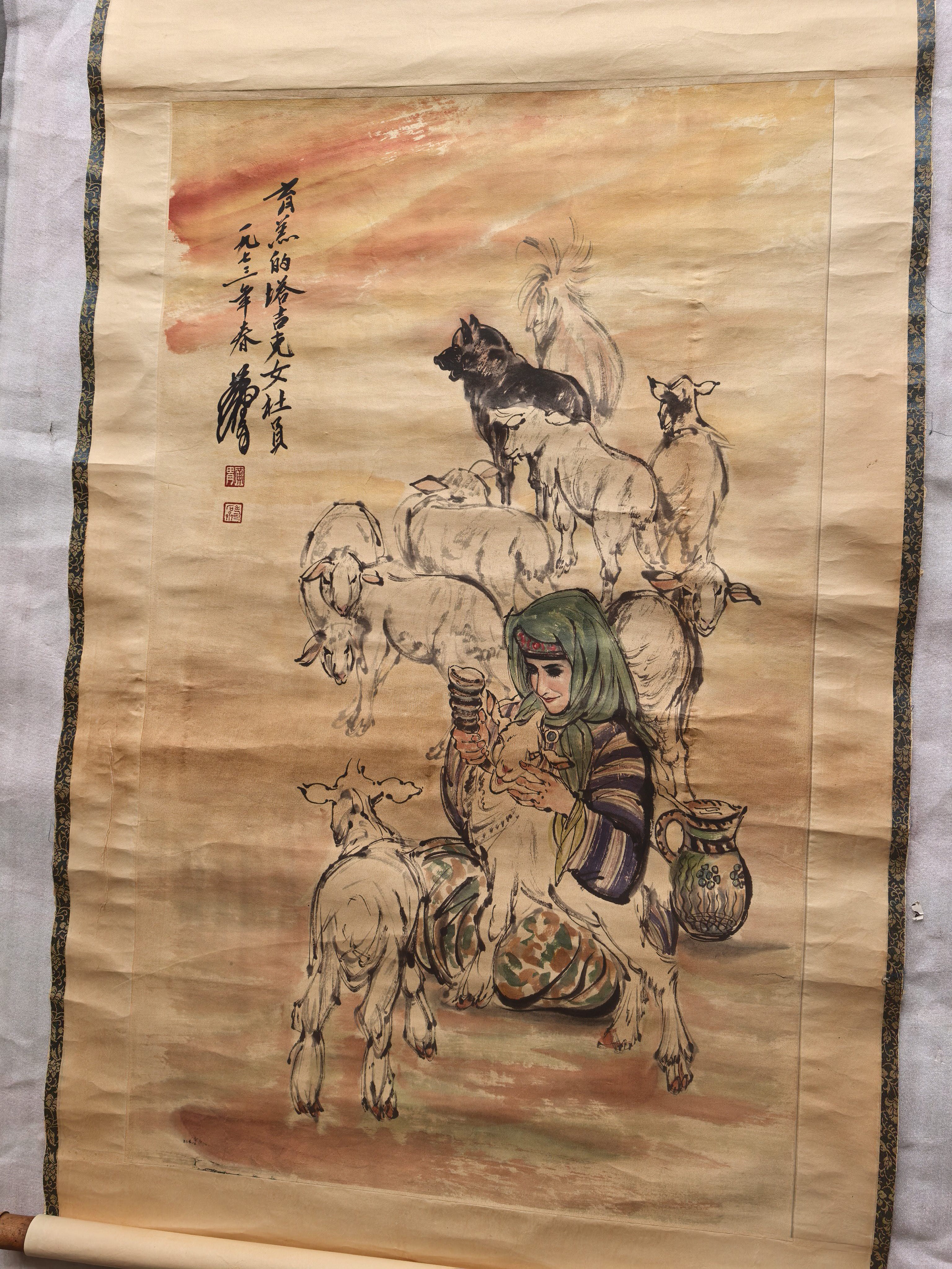 一九七三年，黄胄画。肓羔的塔吉克女社员